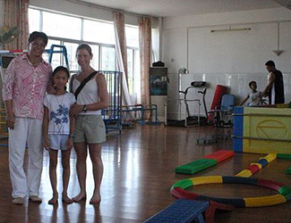 Our Daughters with the Director in the Physical Therapy Room.