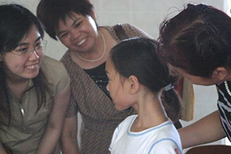 Our Daughter Being Greeted by 3 Orphanage Staff Members.