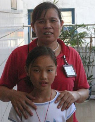 Our Daughter with an Orphanage Staff Member.